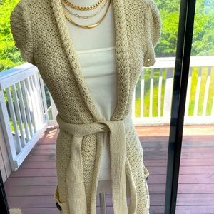 BCBGeneration cream colored crochet like cardigan. Long. Comes to upper thigh.